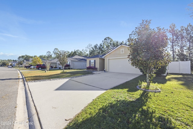 single story home with a garage and a front lawn