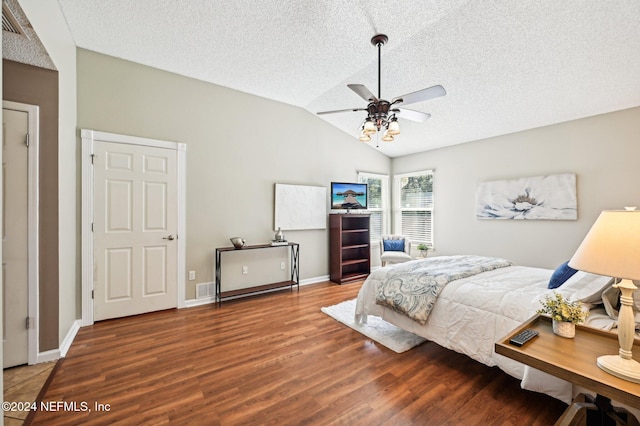 bedroom featuring a textured ceiling, ceiling fan, wood-type flooring, and lofted ceiling