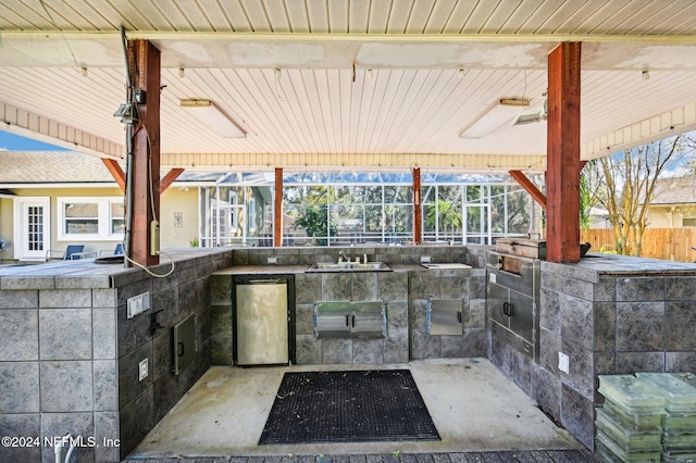 view of patio featuring sink and exterior kitchen