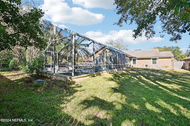 view of yard with a lanai