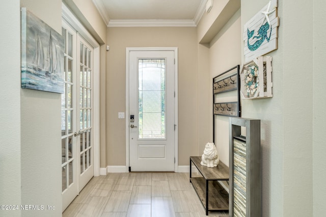 entryway featuring french doors and ornamental molding