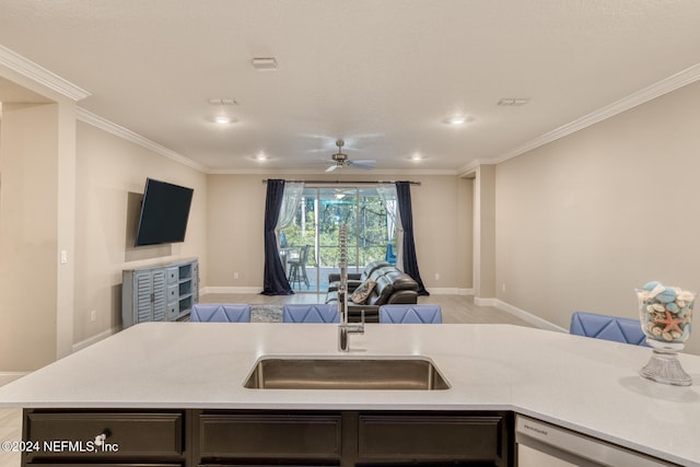 kitchen with dishwasher, a center island with sink, sink, ceiling fan, and ornamental molding