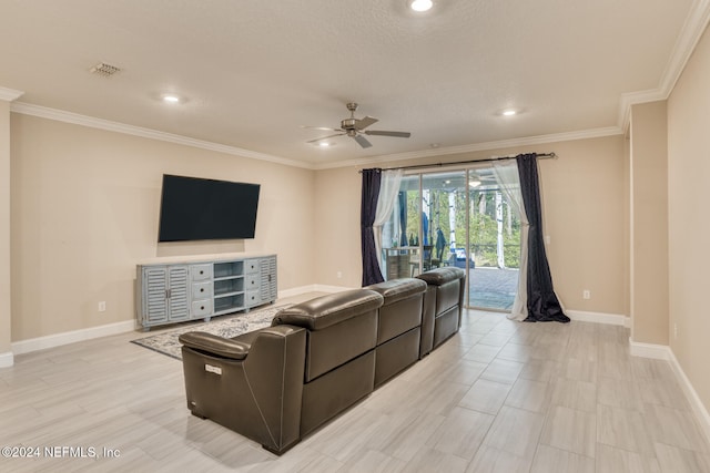 living room featuring ceiling fan and ornamental molding