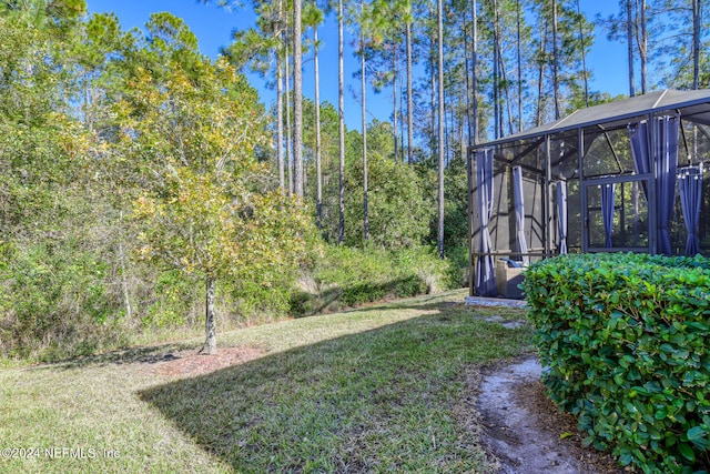 view of yard with a lanai