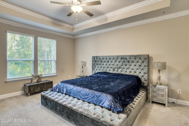 bedroom with carpet, ceiling fan, crown molding, and multiple windows