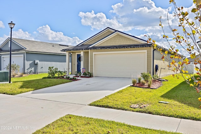 view of front of property with a garage and a front yard