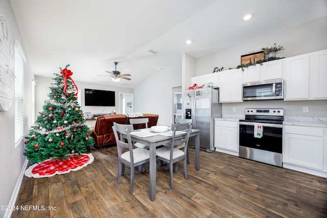 kitchen featuring white cabinets, appliances with stainless steel finishes, and dark hardwood / wood-style flooring