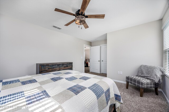 bedroom with ceiling fan and carpet floors