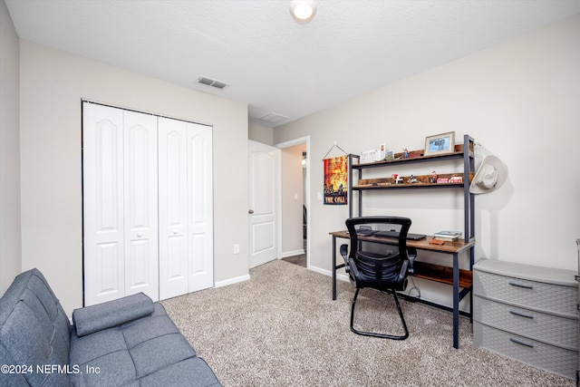 office area featuring carpet and a textured ceiling