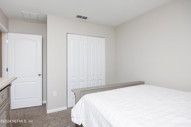 carpeted bedroom featuring a closet