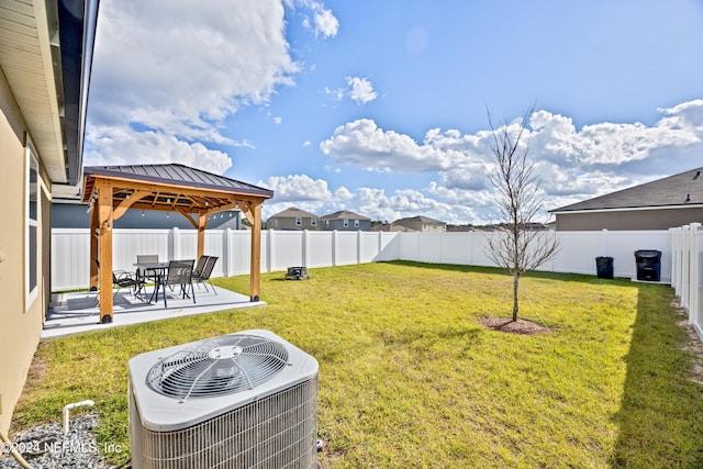 view of yard with a gazebo, cooling unit, and a patio