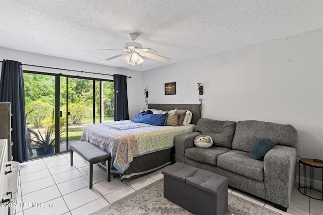 tiled bedroom with a textured ceiling, access to outside, and ceiling fan