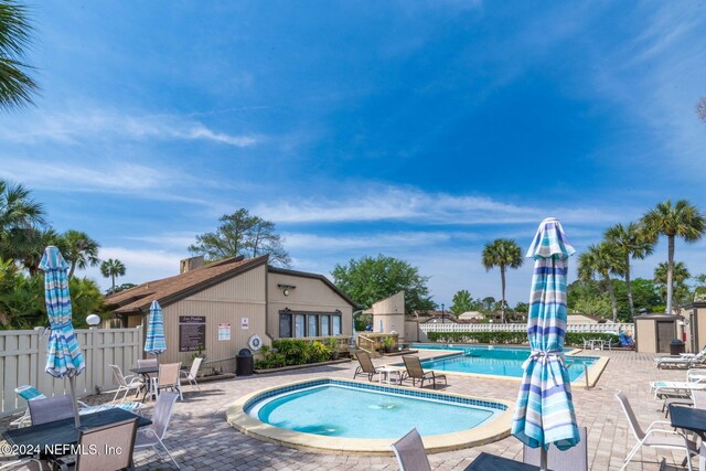 view of swimming pool with a patio