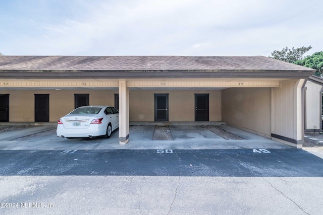 exterior space with a carport