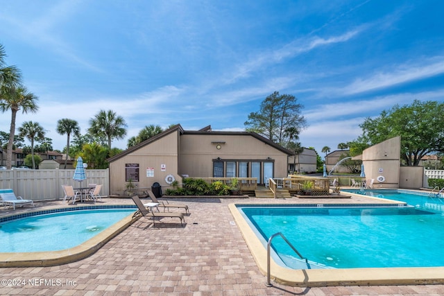 view of swimming pool with a patio area