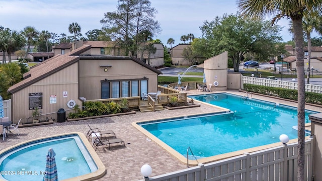 view of swimming pool with a patio area