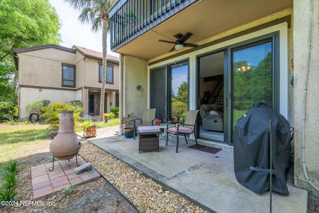 view of patio / terrace featuring a balcony, ceiling fan, and a grill