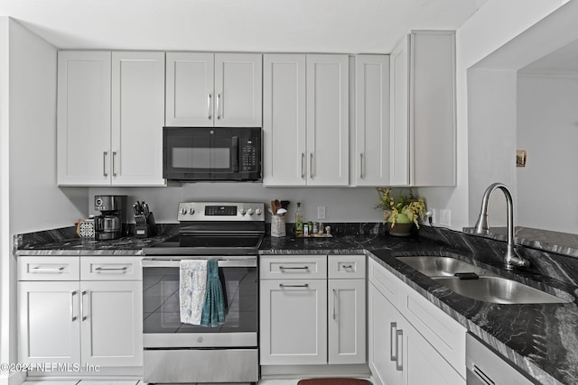 kitchen with stainless steel appliances, white cabinetry, and sink