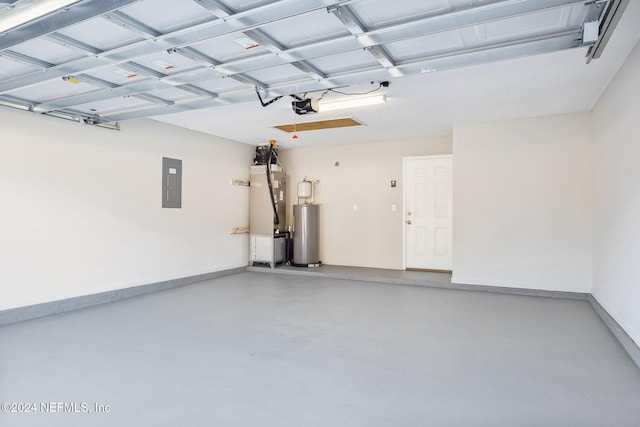 garage featuring electric panel, heating unit, a garage door opener, and gas water heater