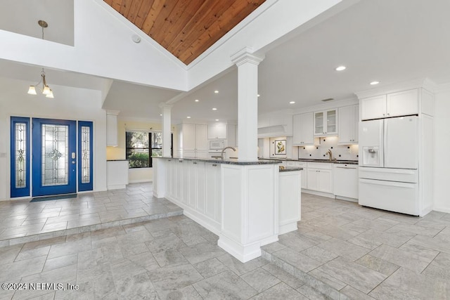 kitchen featuring white appliances, high vaulted ceiling, sink, white cabinetry, and wood ceiling