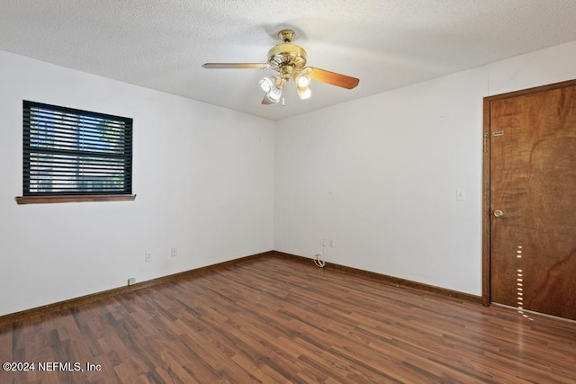 unfurnished room with a textured ceiling, dark hardwood / wood-style floors, and ceiling fan