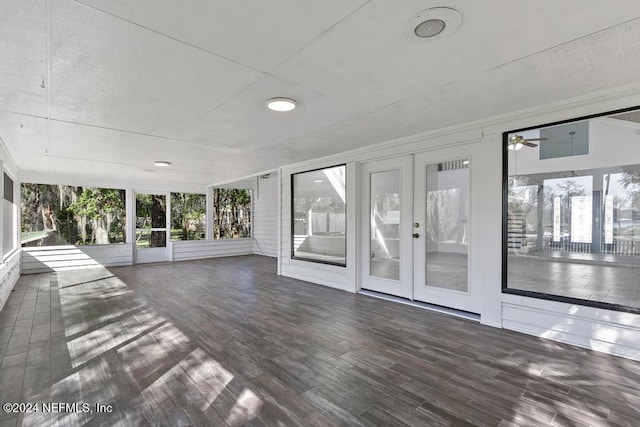 interior space with ceiling fan and french doors