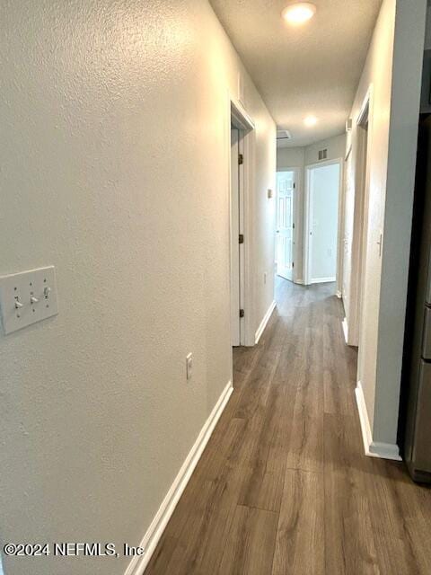 hallway featuring dark hardwood / wood-style floors