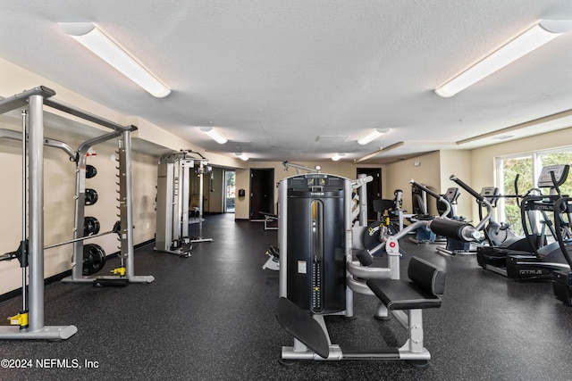 workout area featuring a textured ceiling