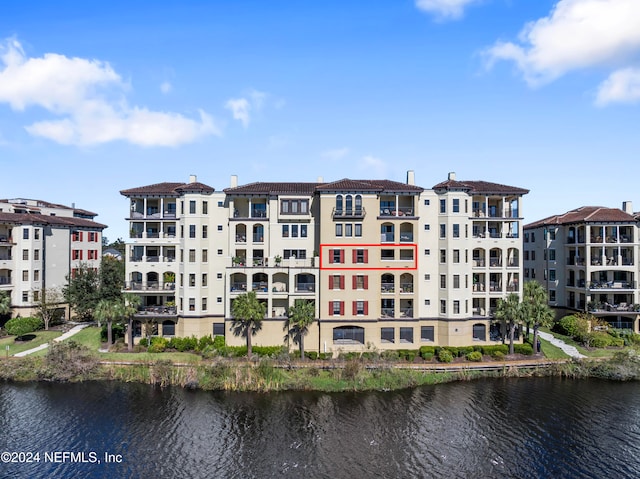 view of building exterior with a water view