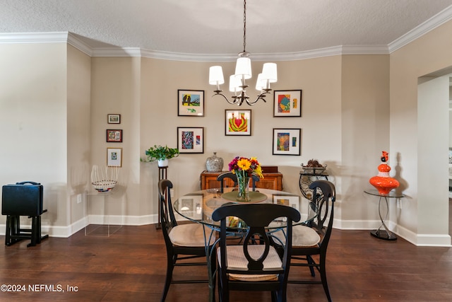 dining room with a notable chandelier, dark hardwood / wood-style floors, ornamental molding, and a textured ceiling