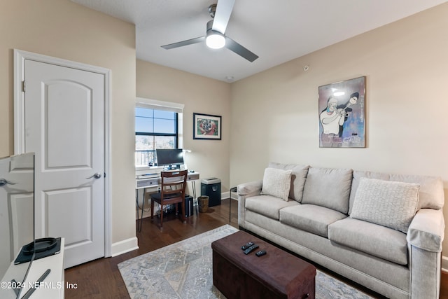 living room featuring dark hardwood / wood-style floors and ceiling fan