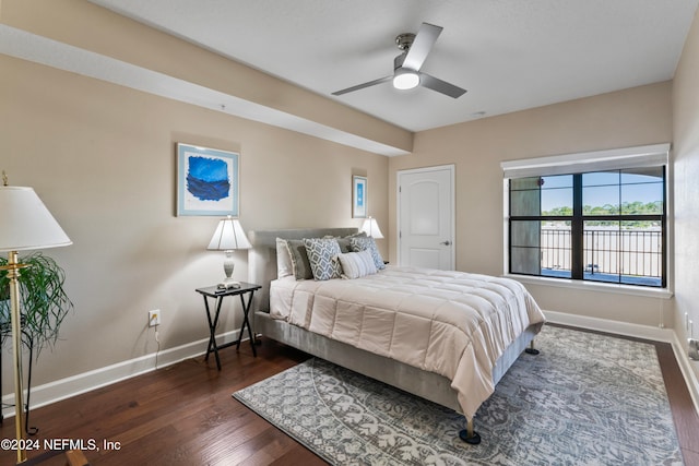 bedroom with ceiling fan and dark hardwood / wood-style flooring