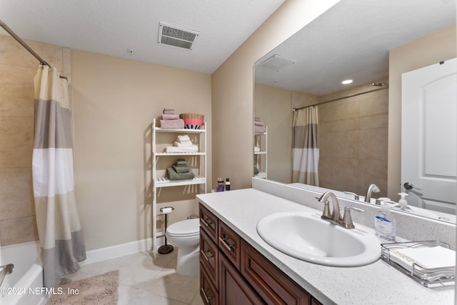 full bathroom featuring a textured ceiling, vanity, shower / bathtub combination with curtain, tile patterned flooring, and toilet