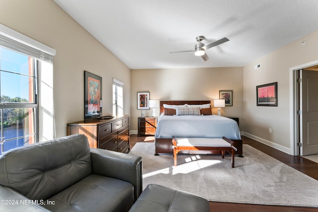 bedroom featuring ceiling fan and dark wood-type flooring