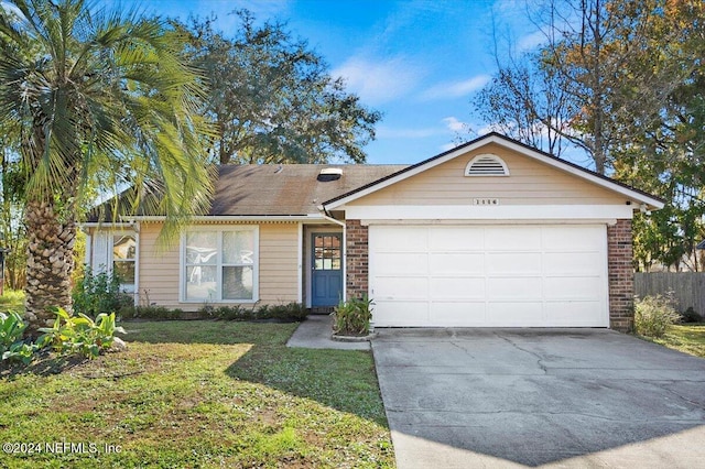 ranch-style home featuring a front lawn and a garage