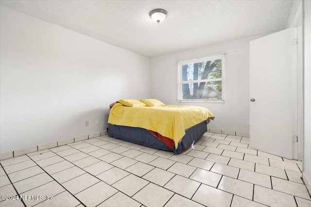 bedroom featuring a textured ceiling