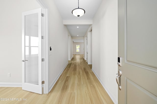 hallway with light wood-type flooring