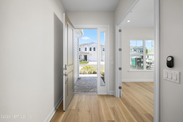 doorway to outside with light hardwood / wood-style floors