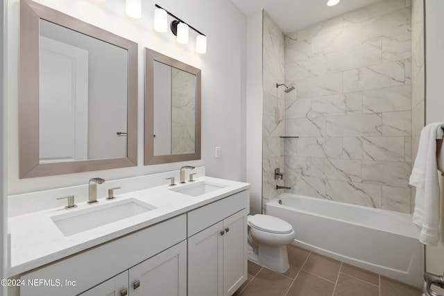 full bathroom with tile patterned floors, tiled shower / bath combo, toilet, and vanity