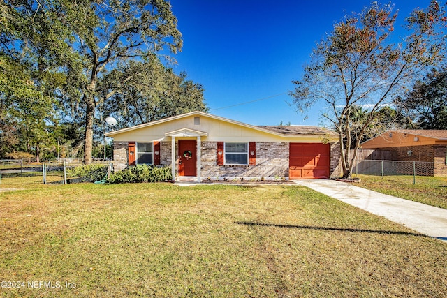 ranch-style house featuring a garage and a front lawn