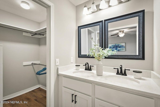 bathroom featuring hardwood / wood-style floors, vanity, and ceiling fan