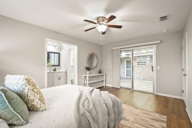 bedroom featuring connected bathroom, ceiling fan, dark wood-type flooring, a textured ceiling, and access to outside