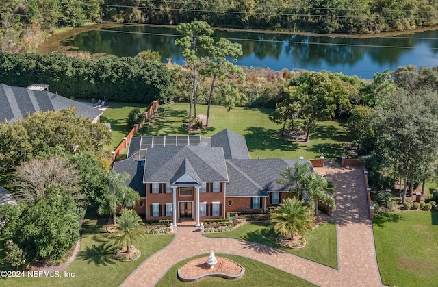 birds eye view of property with a water view