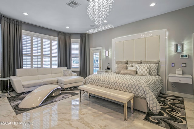 bedroom with a notable chandelier