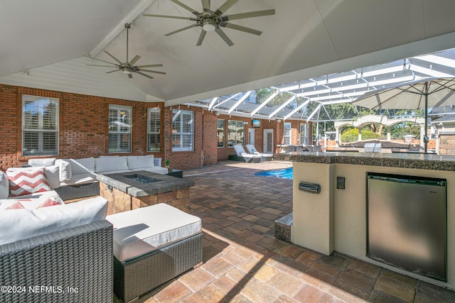 view of patio featuring an outdoor living space and a lanai