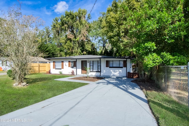 ranch-style house with a front lawn