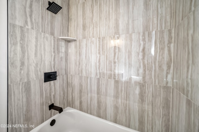 bathroom featuring washtub / shower combination