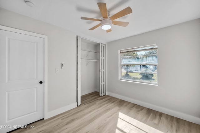 unfurnished bedroom featuring ceiling fan and light hardwood / wood-style floors