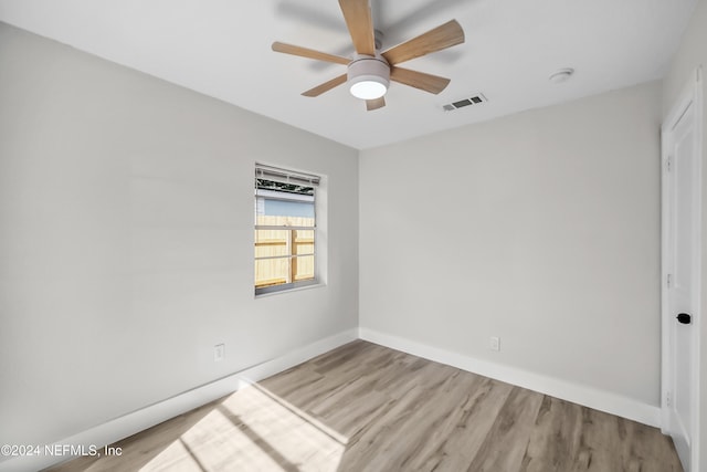 unfurnished room featuring light hardwood / wood-style flooring and ceiling fan