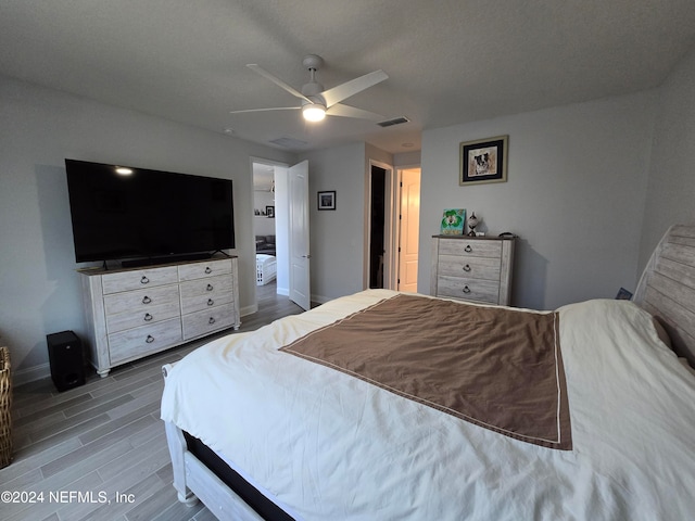 bedroom featuring ceiling fan and wood-type flooring